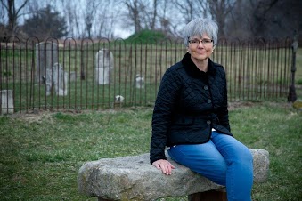 in front of graveyard fence